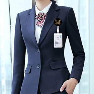 Retractable ID badge holder with butterfly pattern worn on a professional navy blue suit