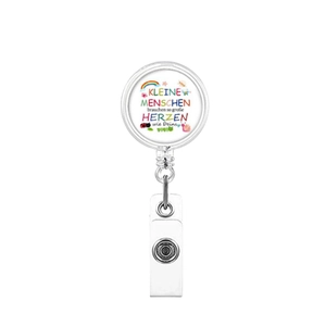 Detail of retractable ID badge holder with German quote and colorful rainbow design