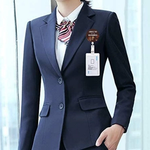 Detail of retractable ID badge reel with religious blessing print on a navy blue suit