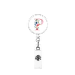 Detailed close-up of a retractable badge holder with floral letter P on white background