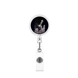Detail showing retractable badge reel with artistic chess design and PVC strap