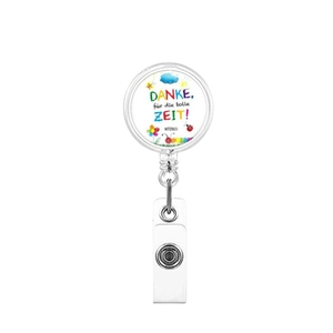 Detail of retractable badge reel featuring cloud and floral illustration with German text