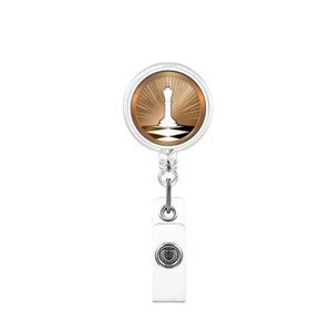 Macro shot of retractable badge reel featuring a chess king icon on a sunburst background