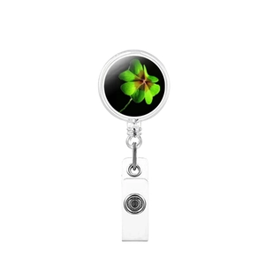 Retractable badge reel with a lucky green four-leaf clover design on a black background