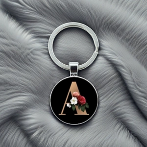 Silver metal letter A keychain with rose flower pattern on a round black charm pendant