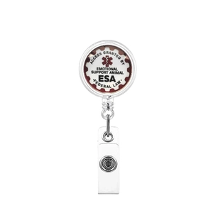 Macro shot of ESA retractable badge reel with medical symbol and federal law text