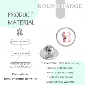 Detailed macro view showing the stainless steel round badge with a floral letter B pattern