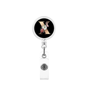 Detail showing retractable badge holder with letter X print and red floral accents