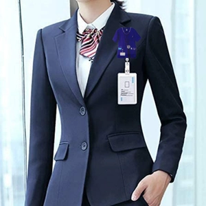 Nurse uniform badge reel with purple scrub design and retractable cord on navy blazer