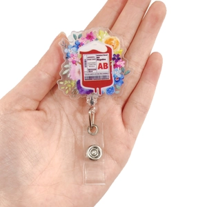 Retractable blood bag badge reel with floral acrylic design for medical workers