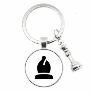 Macro shot of silver alloy chess keychain with Bishop glass gem and 3D metal piece
