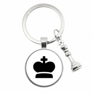 Detailed view of silver chess king pendant keychain with glass cabochon emblem