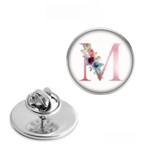 Detail of floral letter M lapel pin with stainless steel butterfly clutch back