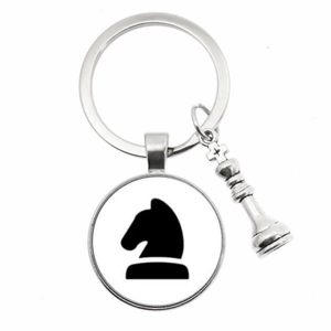 Detail view of silver chess keychain with Knight silhouette and King piece pendant