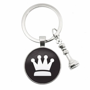 Silver chess keychain with a crown cabochon and a 3D king piece charm on white background