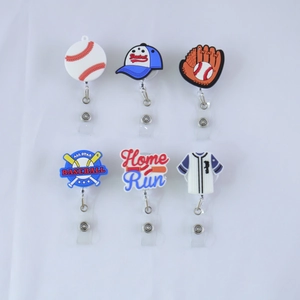 Detail shot of six baseball-themed retractable badge reels with various PVC sport icons