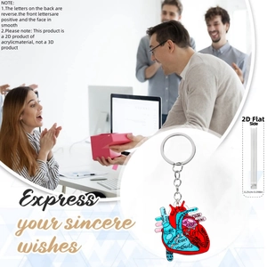 Detail showing anatomical heart acrylic keychain with medical labels and 2D clear texture
