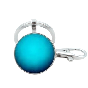 Detail of blue planetary solar system crystal glass keychain with silver metal ring