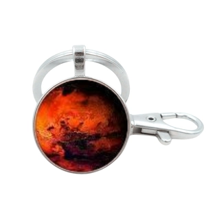 Detail of metal keychain with a dome glass pendant featuring Mars surface planet pattern
