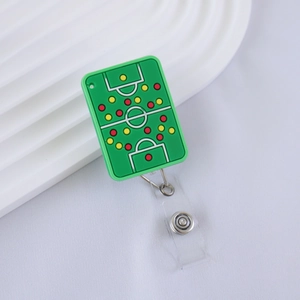 Detail of soccer field retractable badge holder with green silicone tactical board pattern