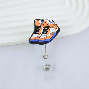 Detailed view of basketball shoe badge reel with retractable cord and PVC pendant