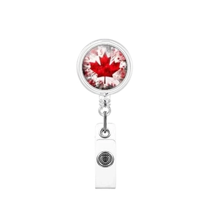 Close-up of retractable badge reel with Canada flag maple leaf design on silver metal