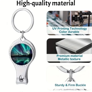 Detail of keychain nail clipper with aurora borealis design and polished silver metal