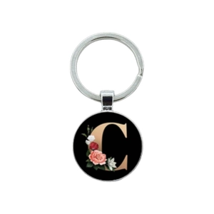 Floral alphabet C keychain with pink roses and white lilies on a round black glass gem