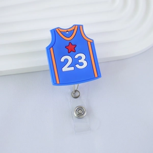 Close-up of blue basketball jersey badge reel with number 23 and retractable metal clip
