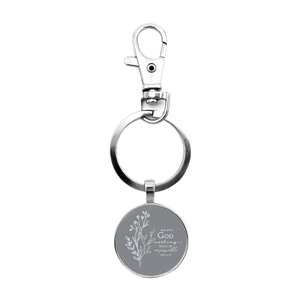 Close-up of engraved Bible verse Luke 1:37 on silver round pendant keychain