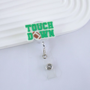 Detail of retractable badge holder with green Touch Down lettering and football motif