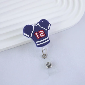 Detail of blue sport jersey badge reel with number 12 and retractable metal hook