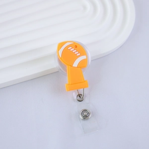 Detail of American football retractable badge reel with orange silicone logo and clear strap