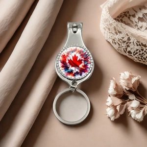 Detailed close-up of a stainless steel Canada maple leaf nail clipper and keychain set