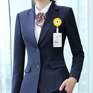 Retractable badge reel with yellow glass cabochon billiard design on blue business suit