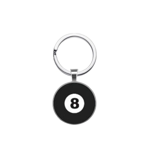 Macro shot of the black 8 billiard ball keychain with polished silver metal ring