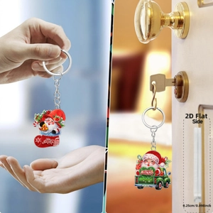 Detail showing 0.25cm thickness of 2D acrylic Christmas Santa and truck keychains