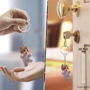 Detail view of 0.25cm thick acrylic cat keychain with 2D flat design and silver ring