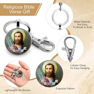 Detailed view of St. Jude religious keychain featuring silver metal clasp and glass cabochon