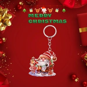 2D acrylic Christmas keychain featuring Santa on a reindeer sleigh with festive red decor