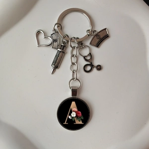 Letter A keychain with stethoscope, syringe, and nurse hat charms for medical professionals