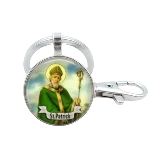 Silver St. Patrick religious medal keychain with green saint icon and lobster clasp