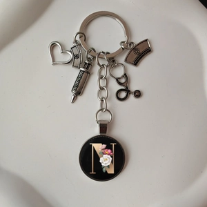 Detailed medical keychain with nurse hat, stethoscope, and letter N pendant charm