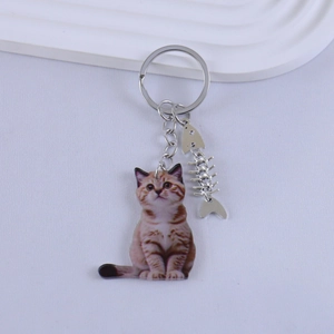 Japanese style resin cat keychain with brown tabby pattern and silver fish bone pendant
