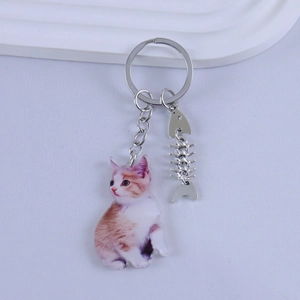 Cartoon resin orange cat keychain with silver fishbone pendant and sturdy metal ring