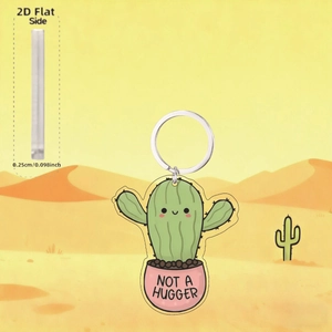 Detail of 2D acrylic cactus keychain showing 0.25cm thickness and Not a Hugger text