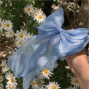 Elegant mermaid blue and apricot bow hair clip with fine shimmer and long ribbons
