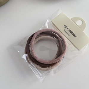 Detail view of high elasticity hair ties set in Morandi colors with clear packaging