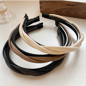 Elegant braided faux leather headbands in beige brown and black for a vintage look
