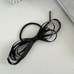 Elegant black ribbon bow hair clip in minimalist French style for women's hairstyles